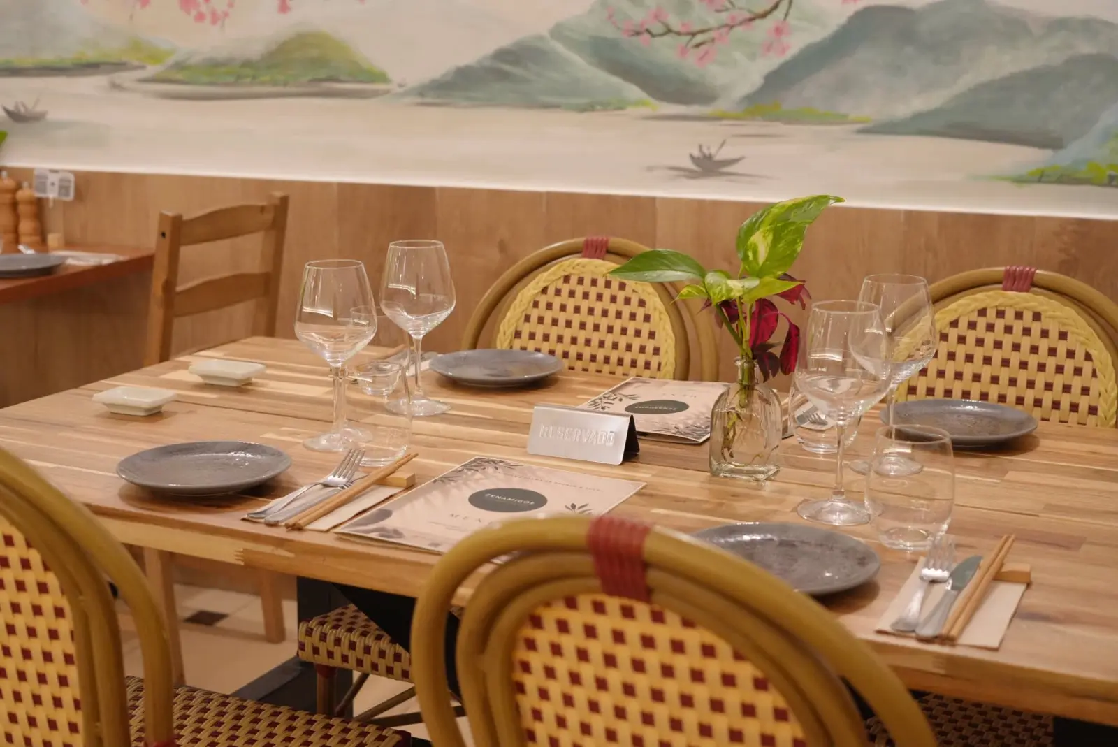 A set table under the painted misty mountains
